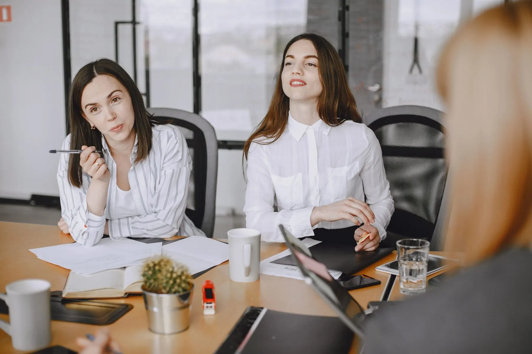 Meeting table with people working together
